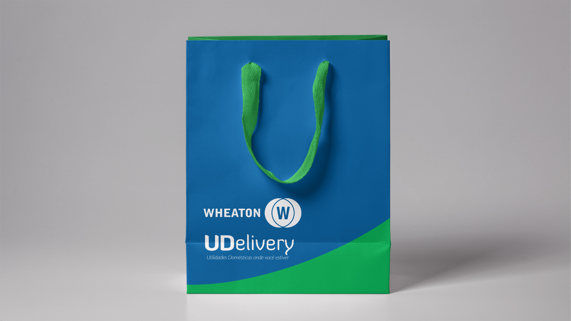 Imagem de sacola de pepel com identidade visual do projeto de PDV móvel Wheaton UDelivery.